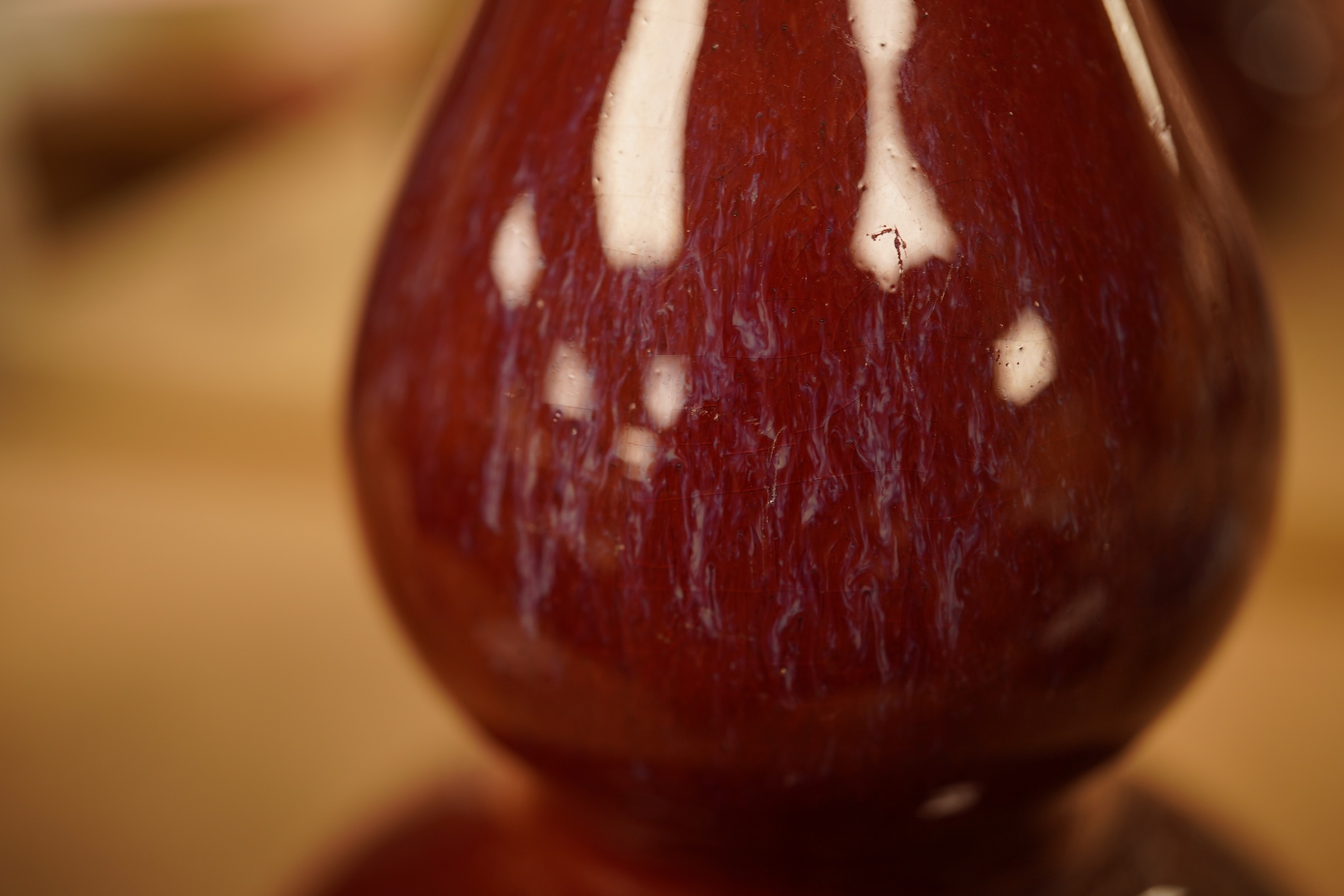 A Chinese Sang De Boeuf glazed double gourd vase, 14.5cm high